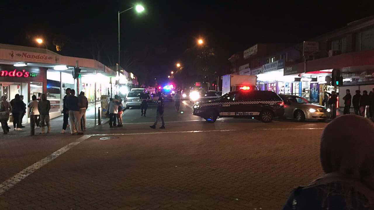 Supplied image of police officers at the scene of an attack in Merrylands in western Sydney, Thursday, July 21, 2016.