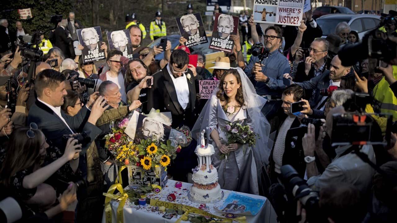 Stella Moris cuts a wedding cake after leaving HM Prison Belmarsh following her wedding to Wikileaks founder Julian Assange.