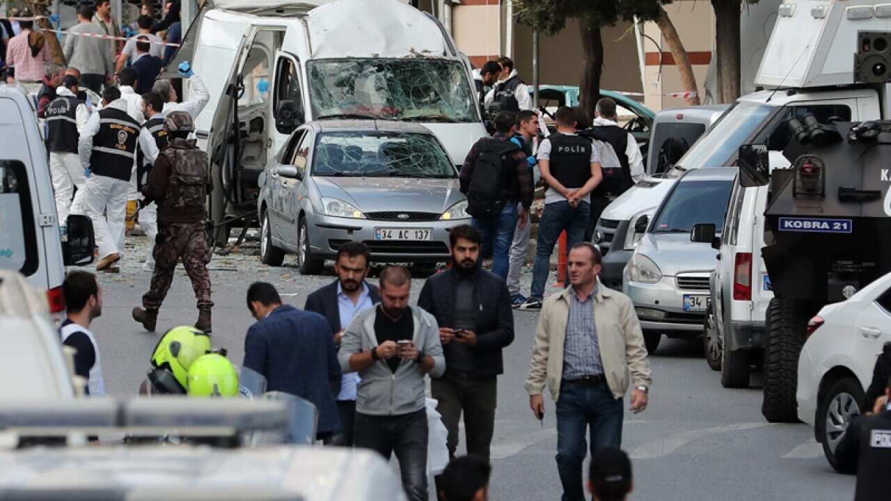 Turkish forensic police officers search the area for evidence