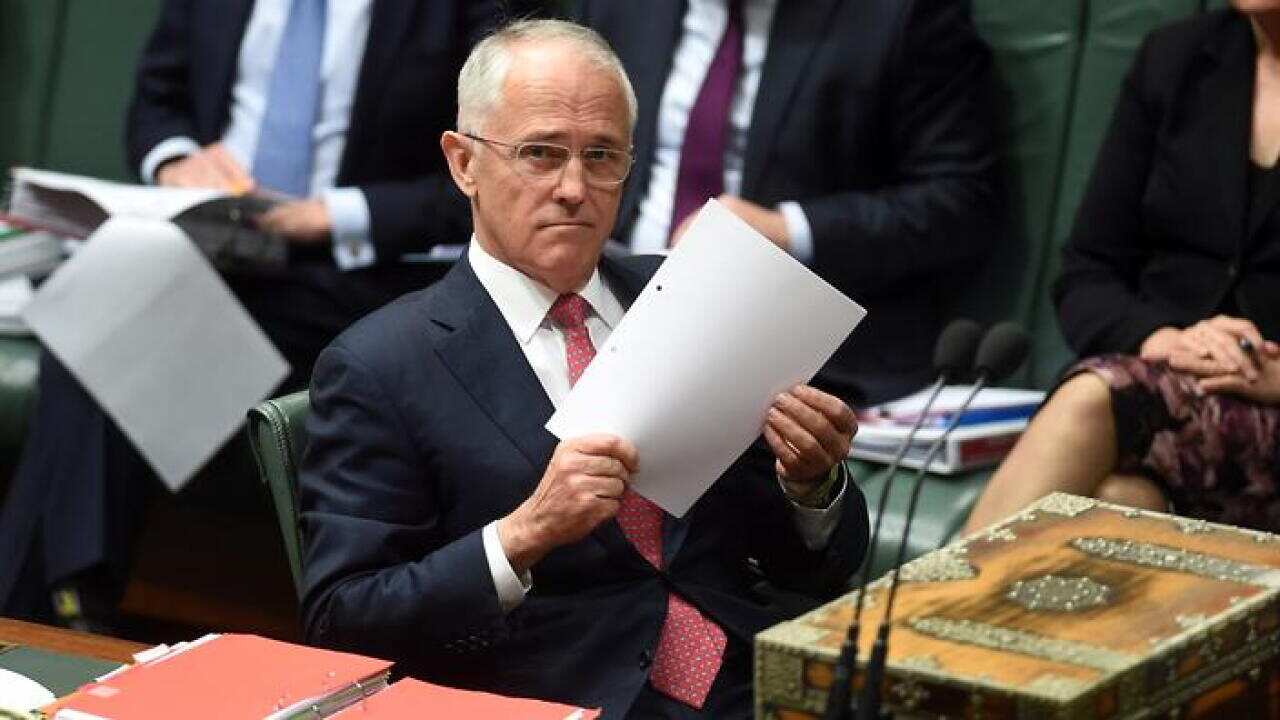 Australian Prime Minister Malcolm Turnbull reacts during House of Representatives Question Time at Parliament House in Canberra, Tuesday, Oct. 11, 2016.