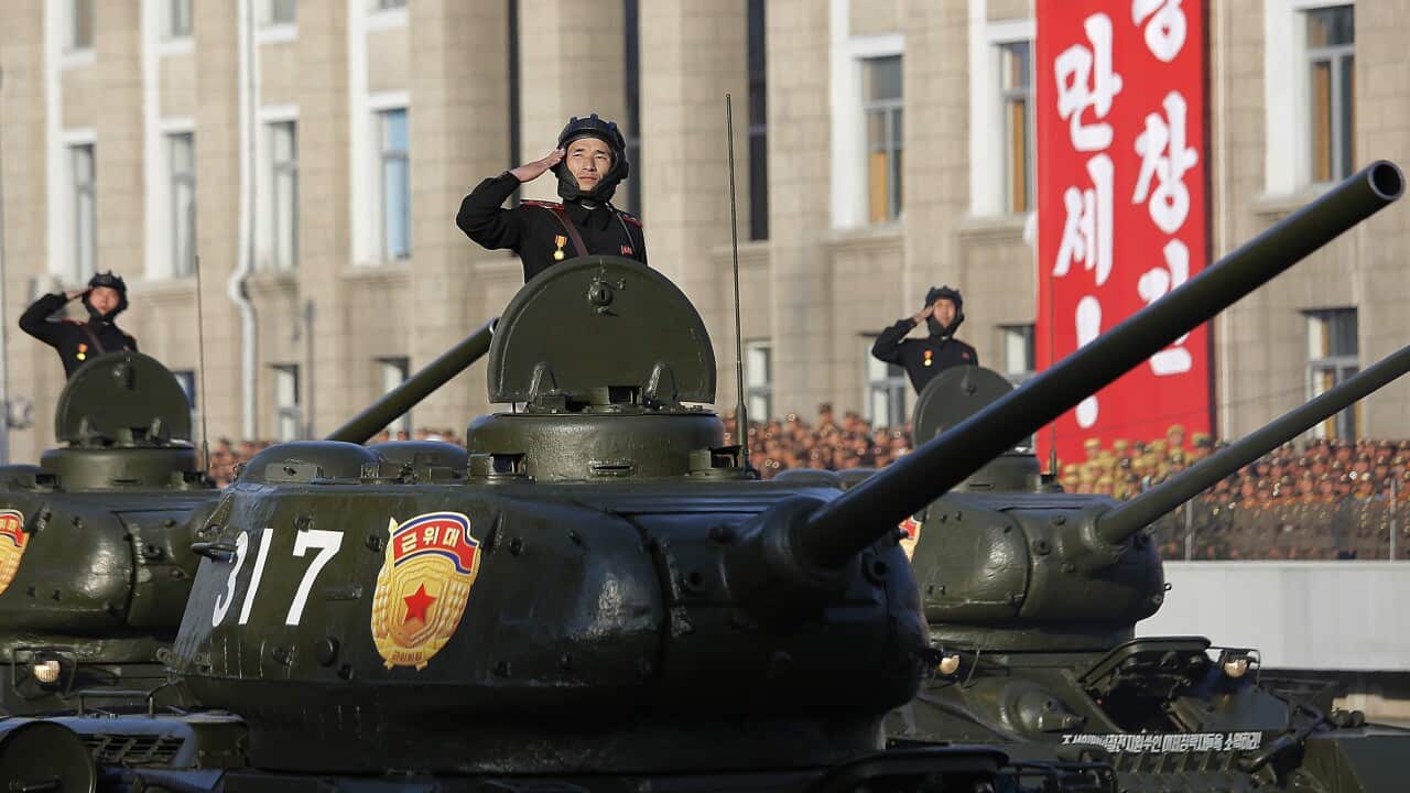 North Korean soldiers parade through Kim Il Sung Square