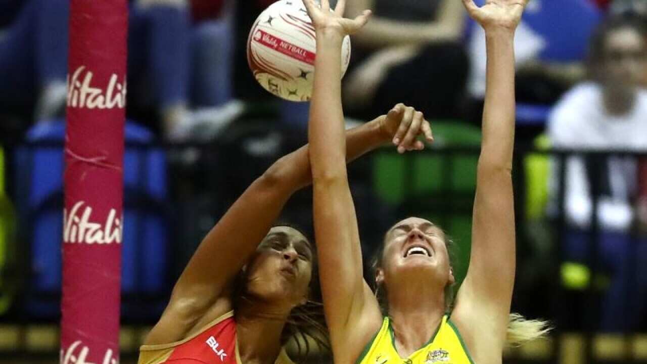 Players reach for the ball