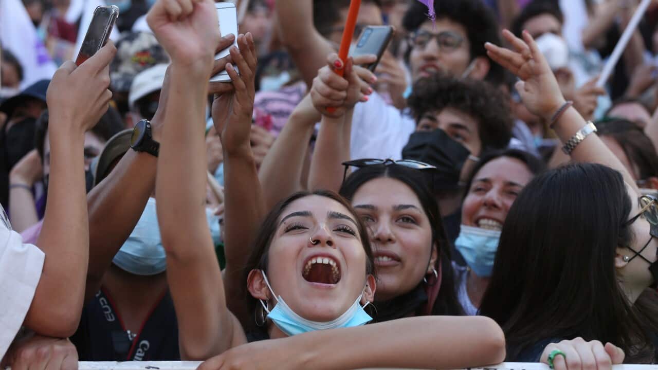 People celebrate the victory of presidential candidate Gabriel Boric, in Santiago, Chile 19 December 2021.