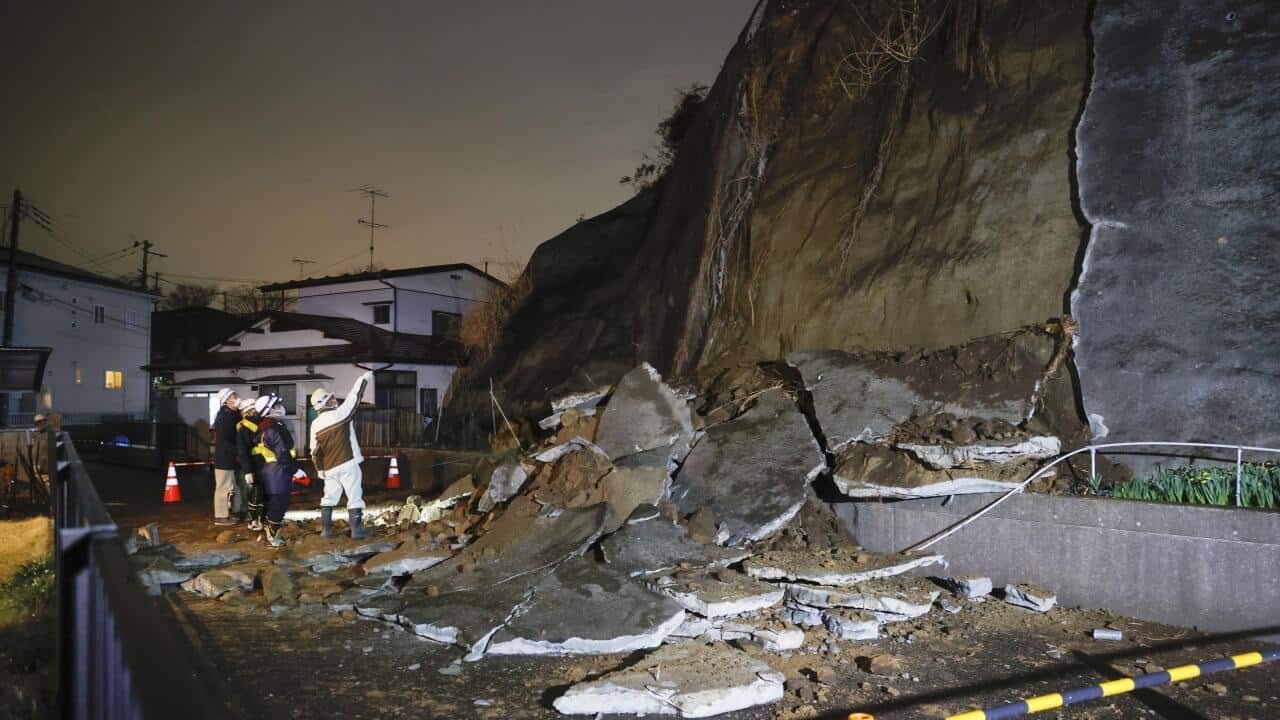 Photo taken March 20, 2021, shows collapsed parts of a cliff in Shiogama, Miyagi Prefecture, after a powerful earthquake struck northeastern Japan. (Kyodo via AP Images) ==Kyodo