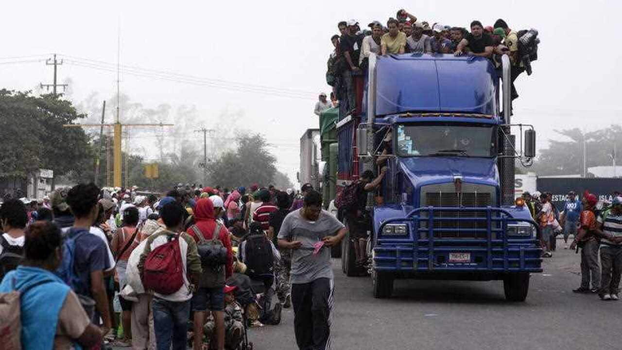 Members of the migrant caravan continue on their way into Mexico.
