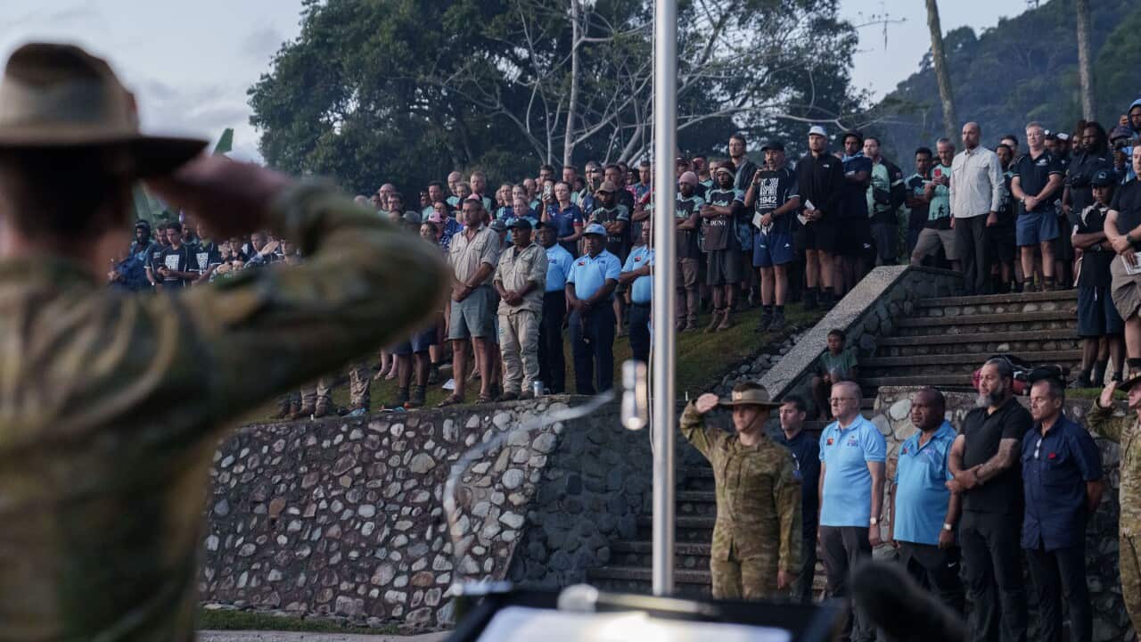 People at an Anzac Day dawn service.