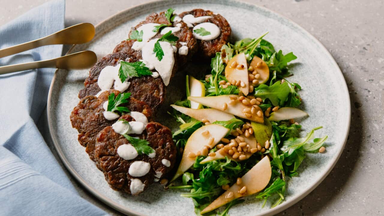 Corned beef fritters with pear and rocket salad