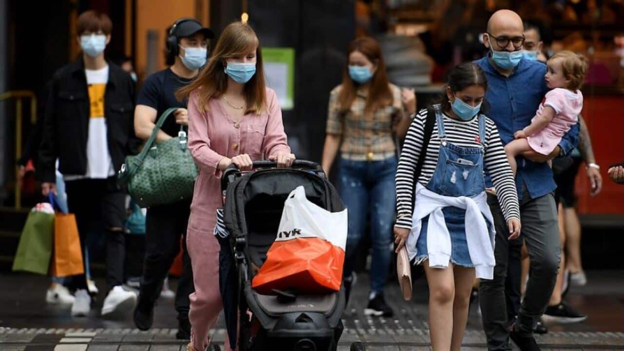 People are seen wearing masks in Sydney, Saturday, 2 January, 2021.