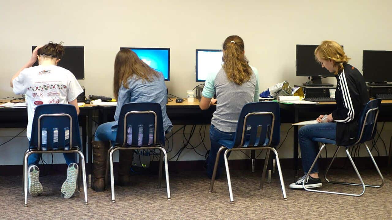 Teenage Girls Working on Project in Computer Lab, Wellsville, New York