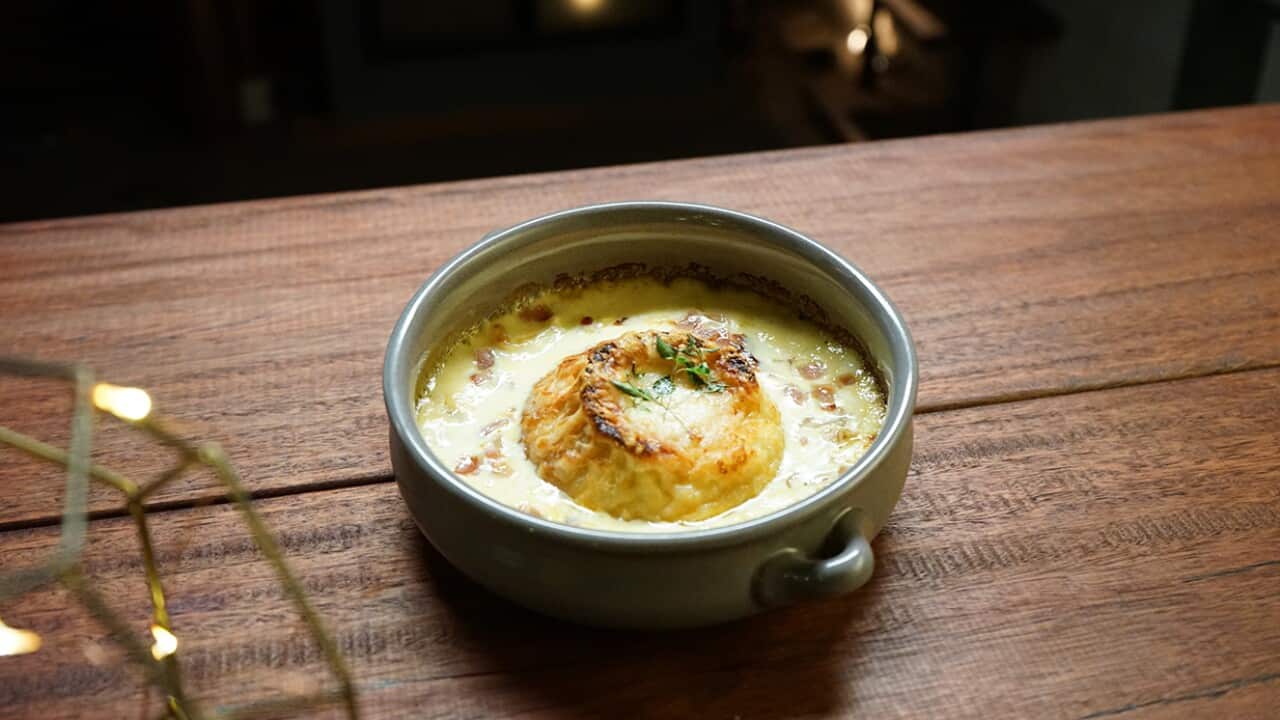 Twice-cooked cheese soufflé with thyme and pancetta sauce