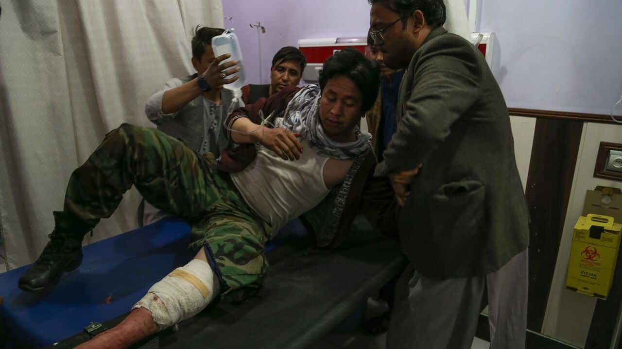 A wounded man receives treatment in a hospital following a suicide bomber blew himself up in an education centre, in Kabul on 24 October, 2020.