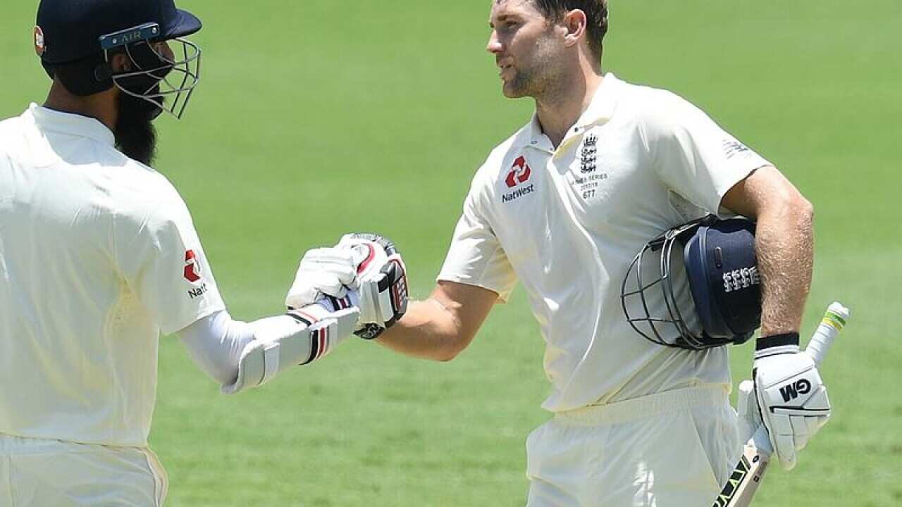 England batsman Dawid Malan shakes hand with a fellow teammate