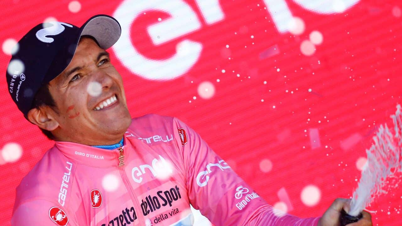Movistar's Richard Carapaz celebrates after in the pink jersey after Stage 20 of the 102nd Giro d'Italia (Getty)