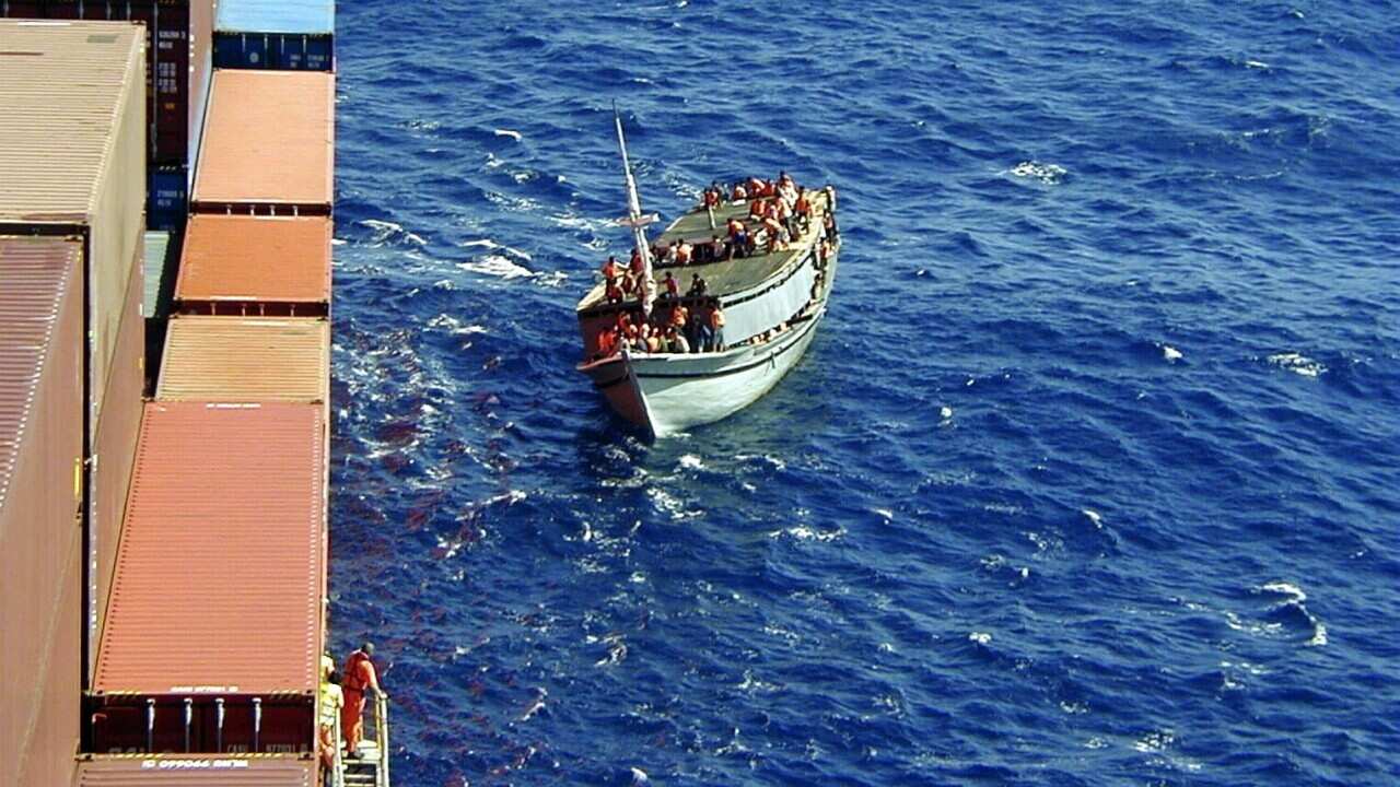 The boat pulls alongside the Tampa