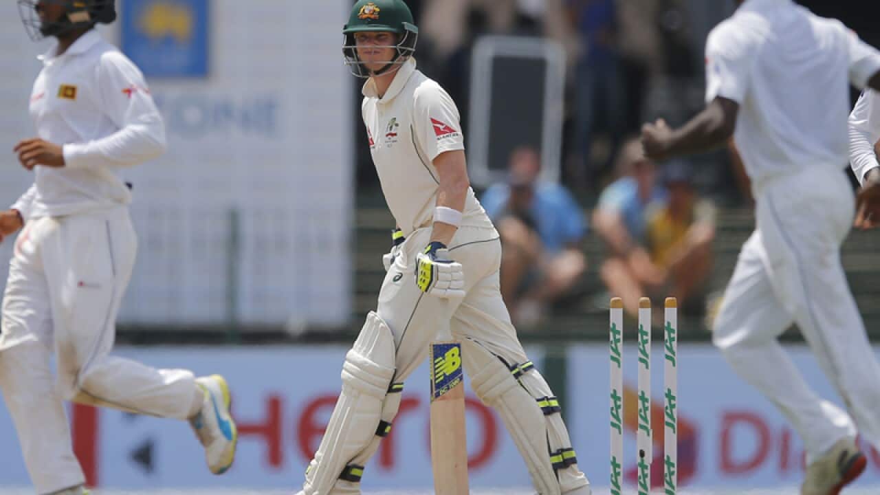 Australian cricket captain Steve Smith (C) is dismissed