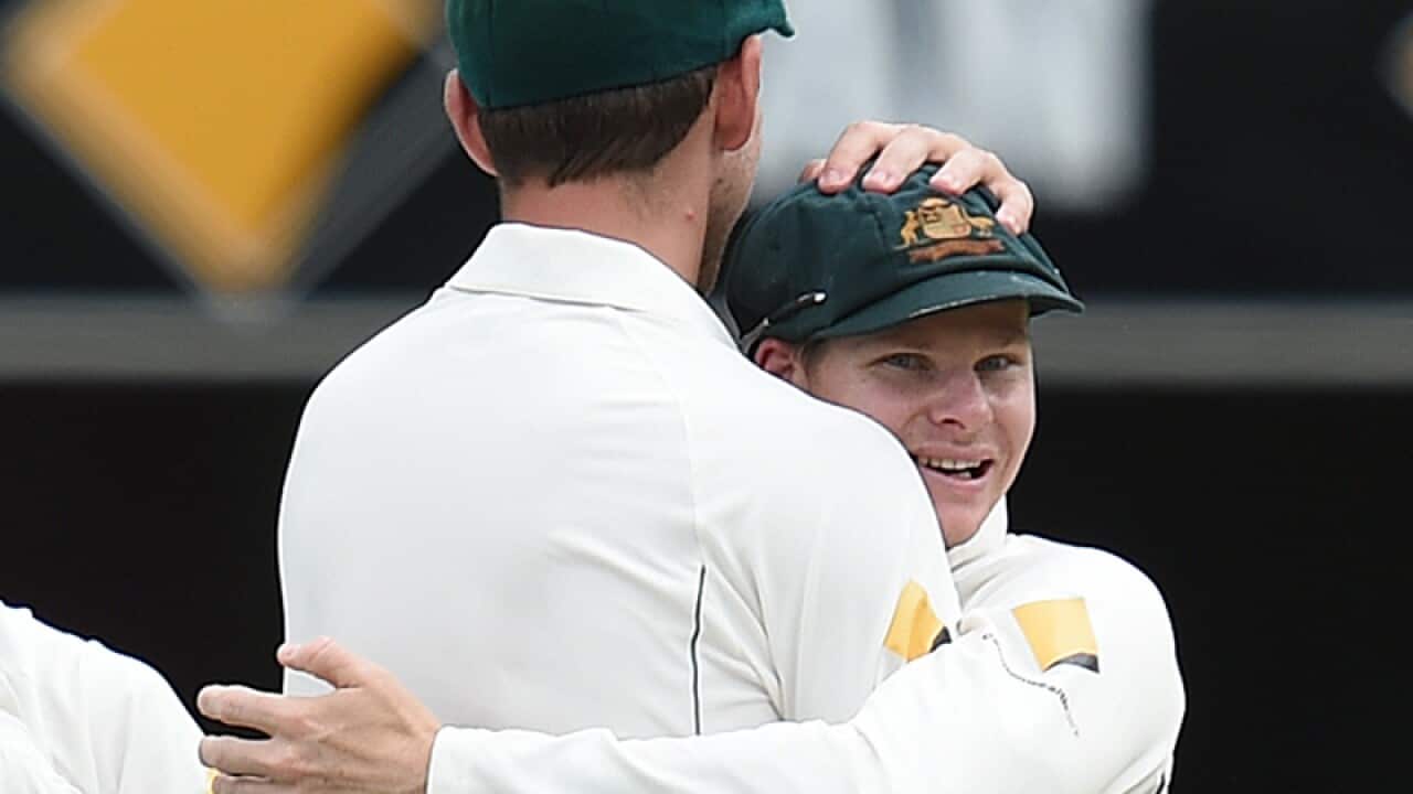 Australian captain Steve Smith (right) hugs Mitchell Starc