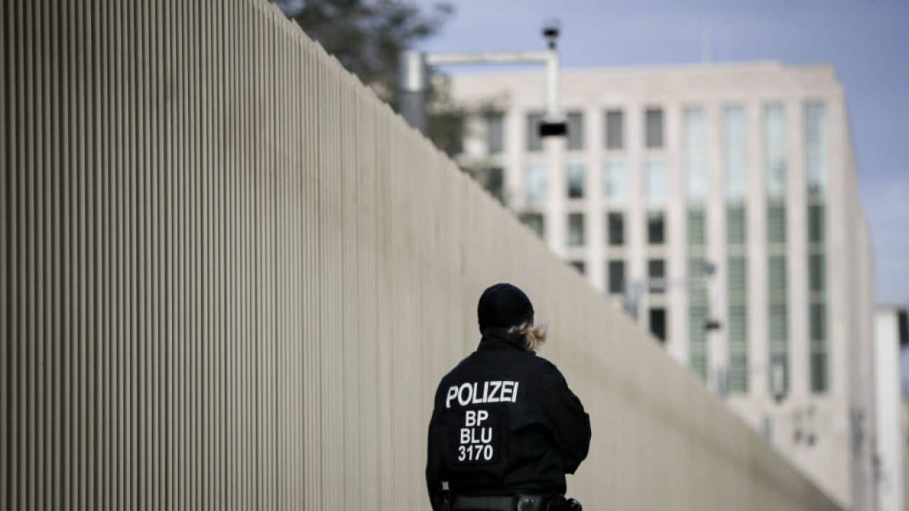 A German police officer stands in front of the new German Federal Intelligence Service (BND) headquarters.