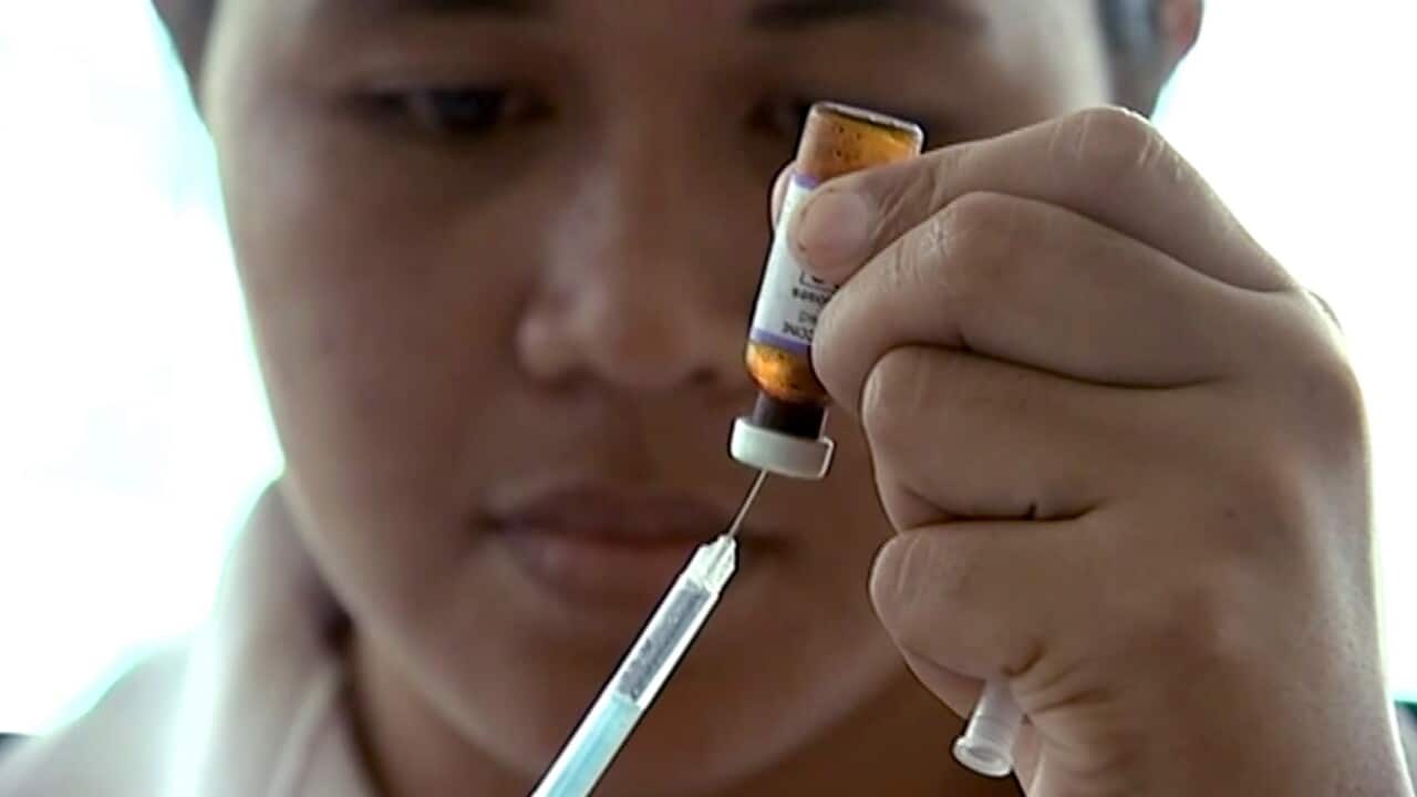 A New Zealand health official prepares a measles vaccination at a clinic, Monday, Nov. 25, 2019, in Apia, Samoa.