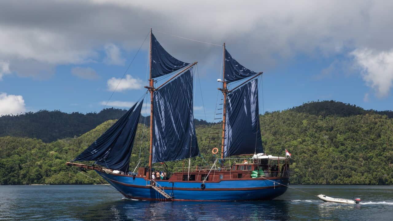 Pinisi Schooner With Sails Up in Raja Ampat