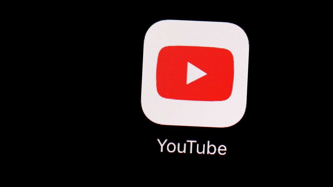The YouTube app is seen on an iPad.