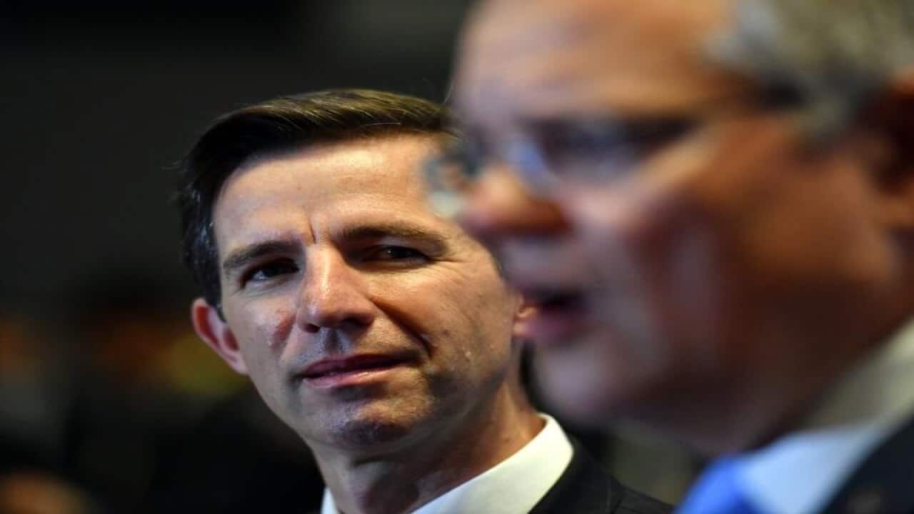 Australia's Minister for Trade Simon Birmingham (L)