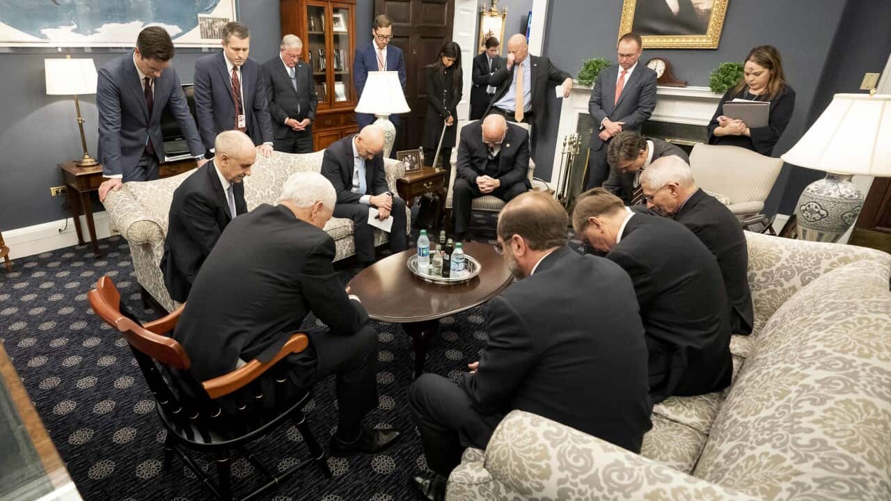 Mike Pence prays during a meeting with the US Coronavirus Taskforce.