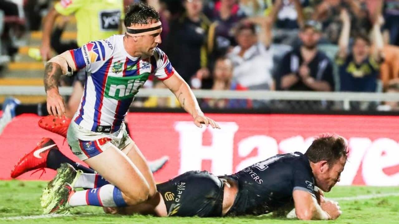 North Queensland Cowboys forward Gavin Cooper scores a try