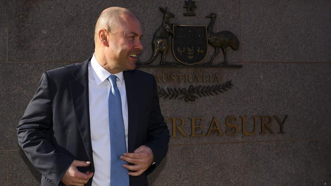 Treasurer Josh Frydenberg outside the Treasury building in Canberra