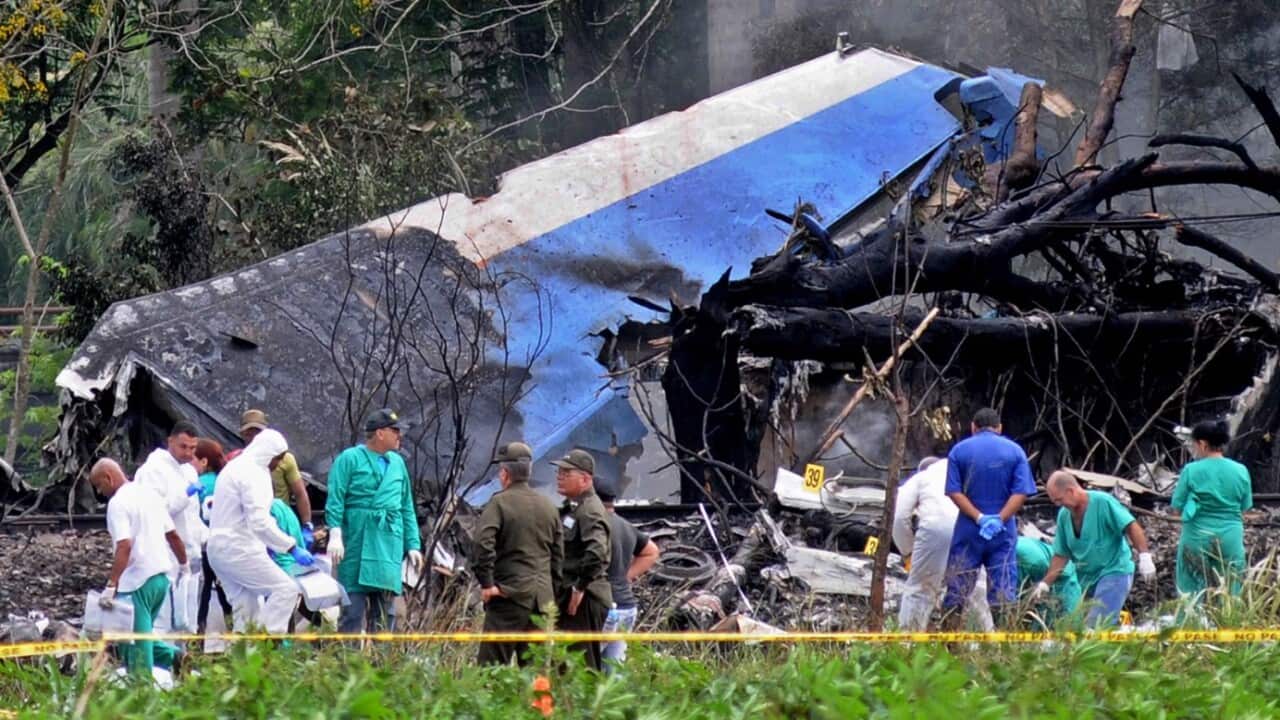 Police and military personnel work among the wreckage of the Boeing-737 plane that crashed shortly after taking off from the Jose Marti airport in Havana