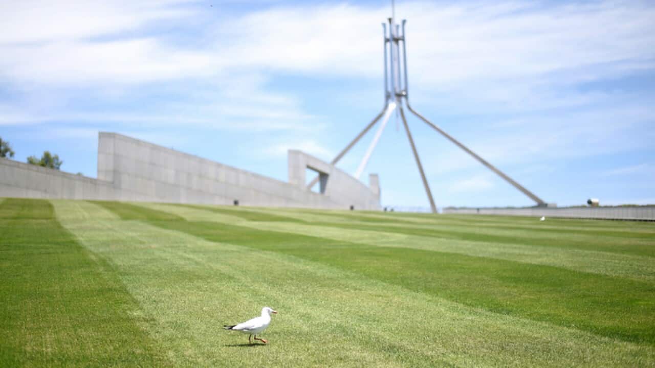 An imminent tightening of security at Parliament House threatens to deny public access to its signature sloping lawns. (AAP Image/Lukas Coch) NO ARCHIVING