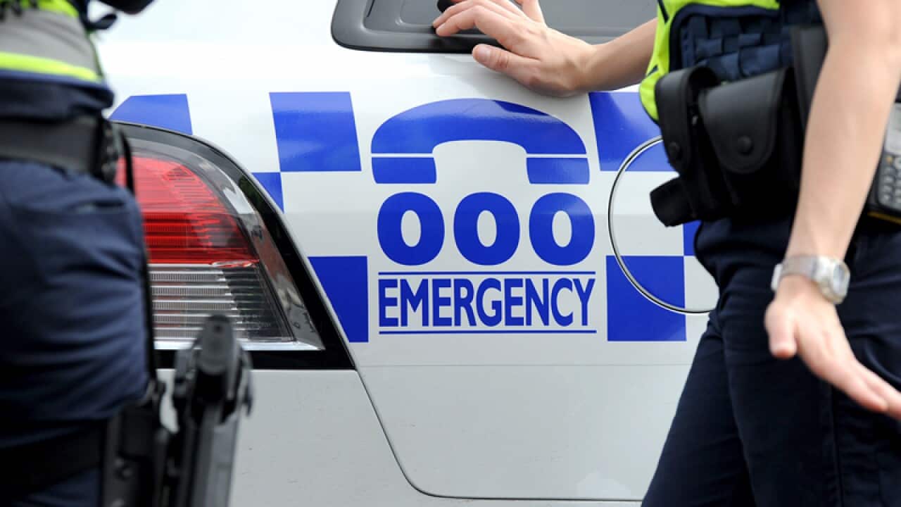 Victorian Police officers outside a crime scene