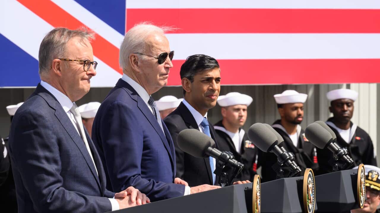 Anthony Albanese, Joe Biden and Rishi Sunak stand at lecterns to announce the AUKUS deal