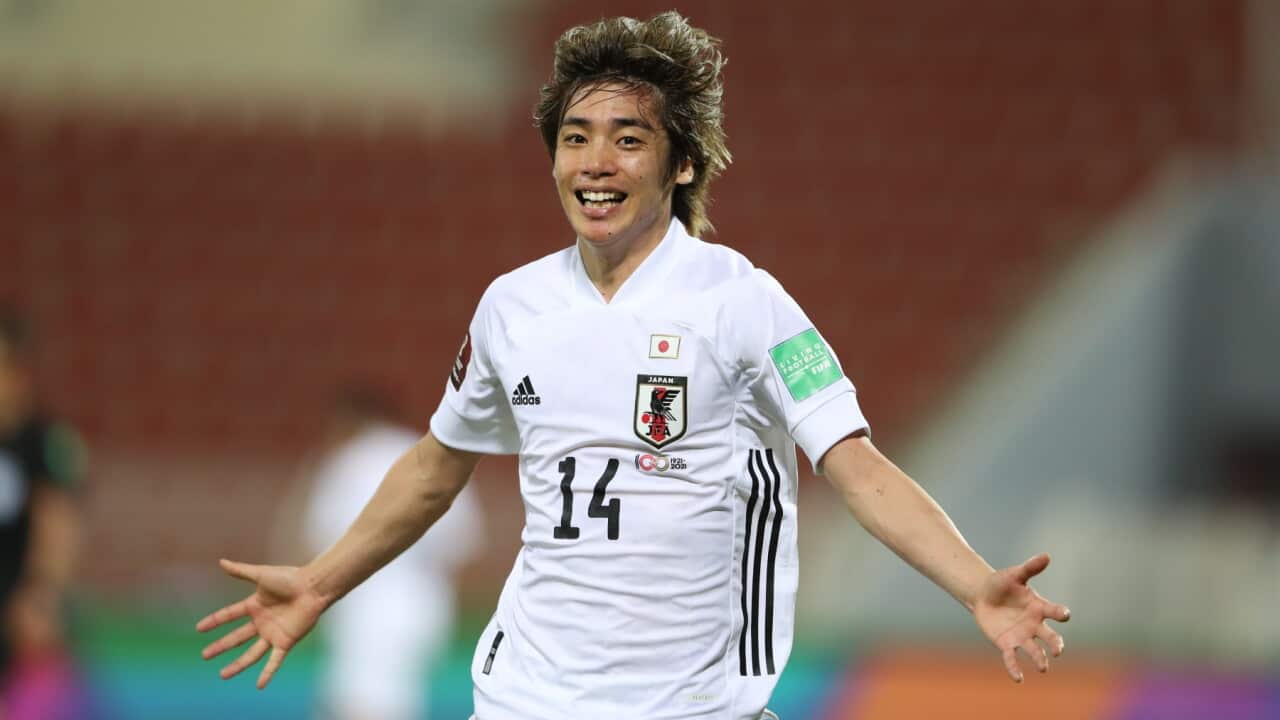 Japan's Junya Ito celebrates after a goal during a a qualifying soccer match for the FIFA World Cup Qatar 2022 between Oman and Japan in Muscat, Oman, Tuesday, Nov.16, 2021.