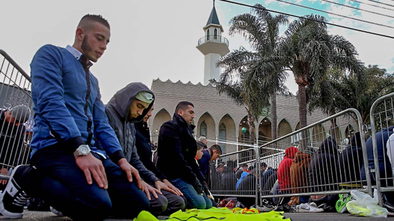 Young Muslims pray in a Sydney Mosque