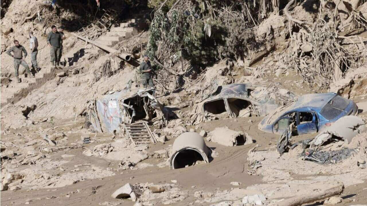 Vehicles partially buried in Poio ravine in the town of Paiporta, Valencia, eastern Spain (AAP)