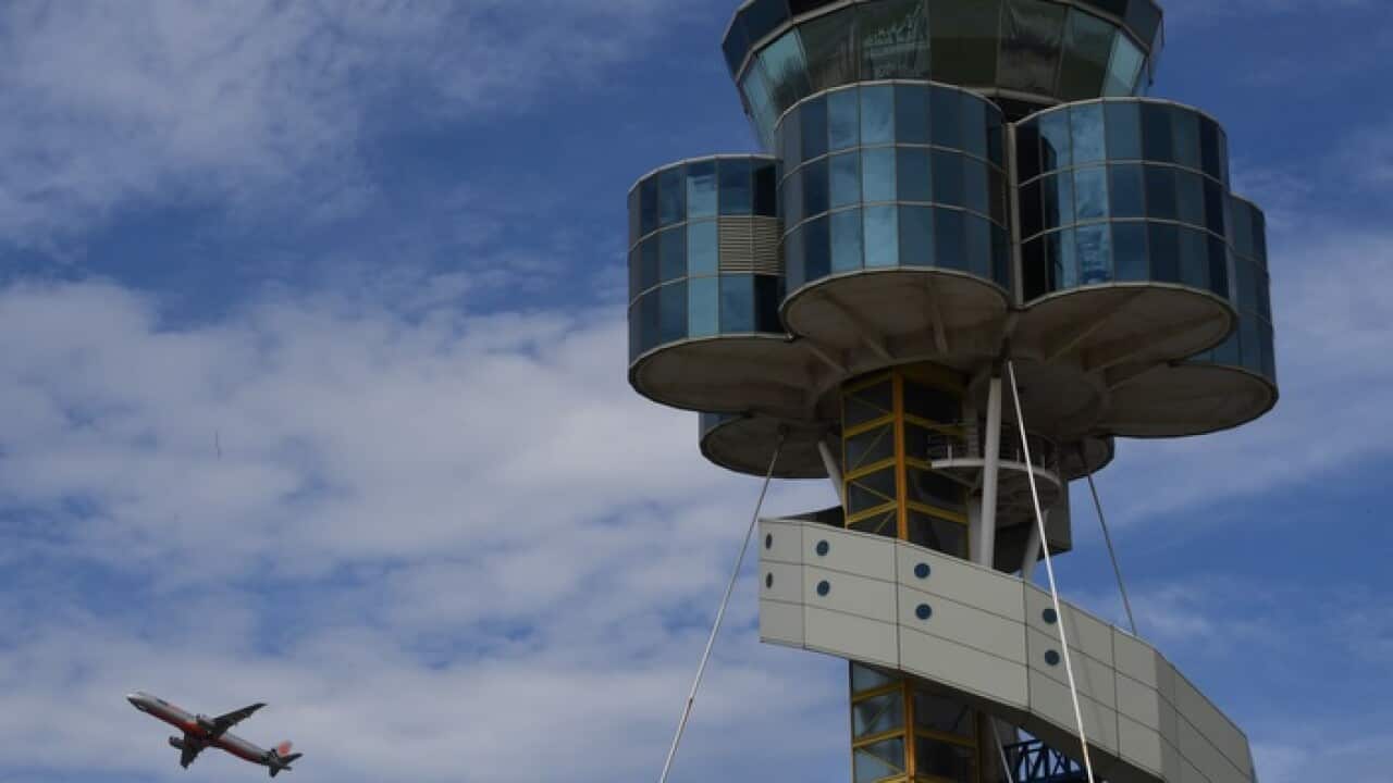 The control tower at Sydney Airport is seen as a plane takes off in Sydney, Friday, March 29, 2019.