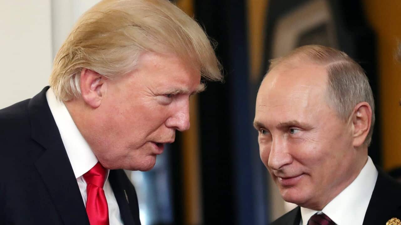 Vladimir Putin and Donald Trump talk at the break of a leader's meeting at the 25th Asia-Pacific Economic Cooperation (APEC) summit in Vietnam.