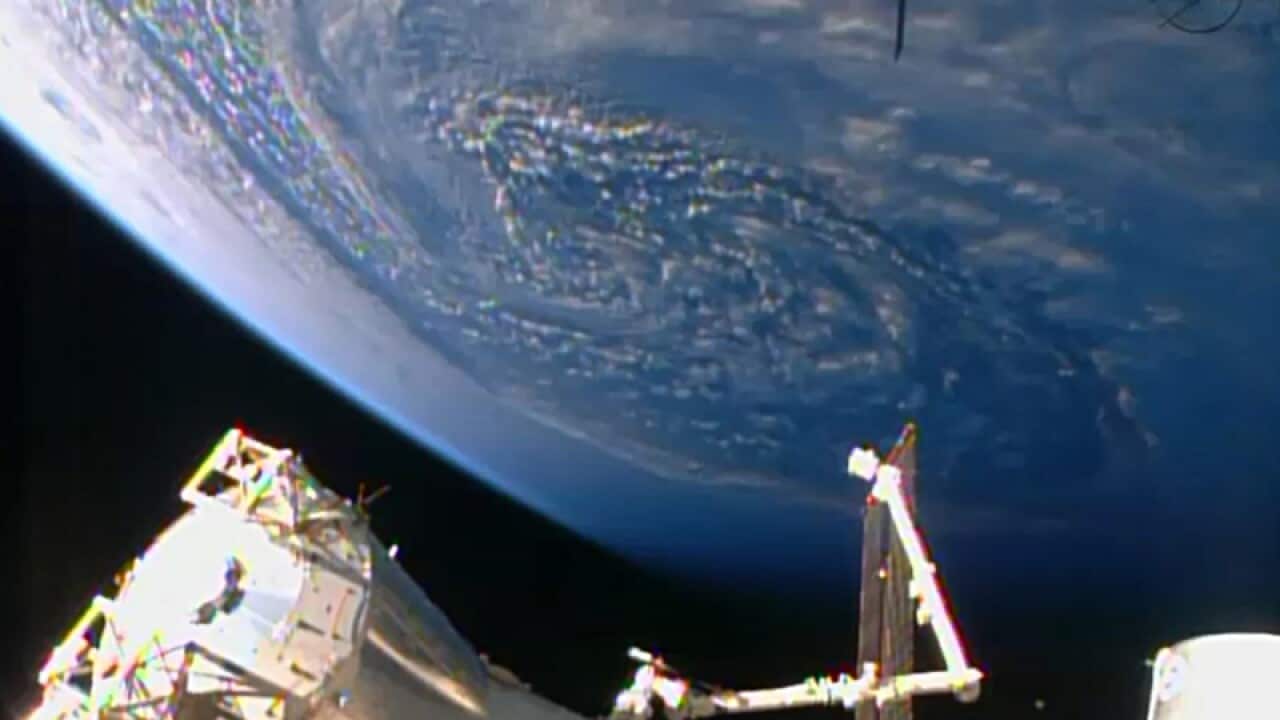 An unmanned cargo ship arrives at the International Space Station.