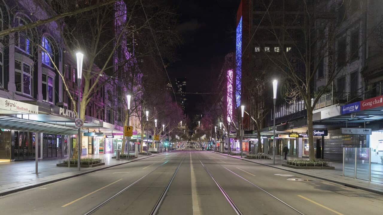 An empty Swanston St at night in the Central Business District as lockdown of Melbourne forces people to stay at home due to the continuing spread of COVID-19.