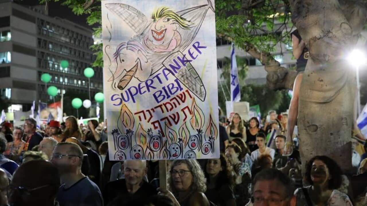 Israelis march in the streets of Tel Aviv