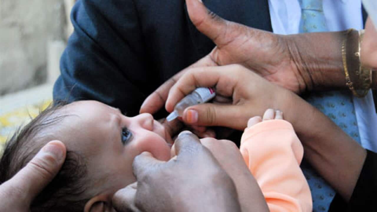 Afghan kid get Polio drop