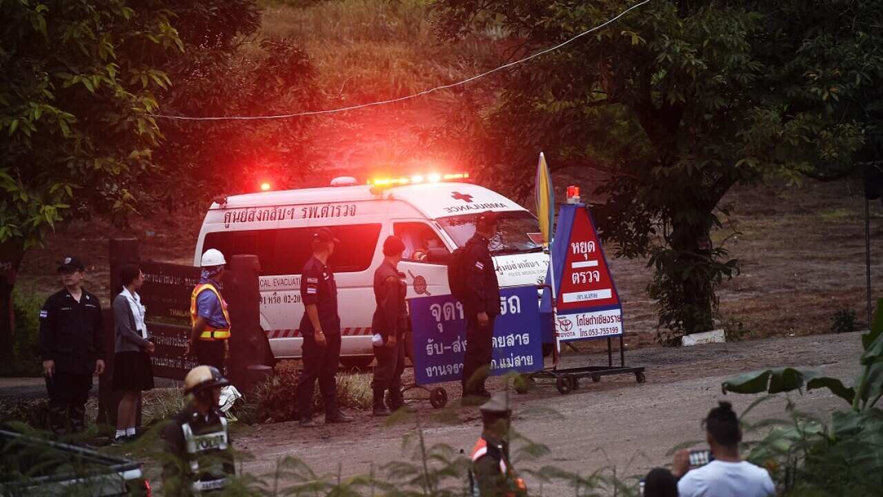 An ambulance leaves the Tham Luang cave area after divers evacuated some of the 12 boys and their coach.