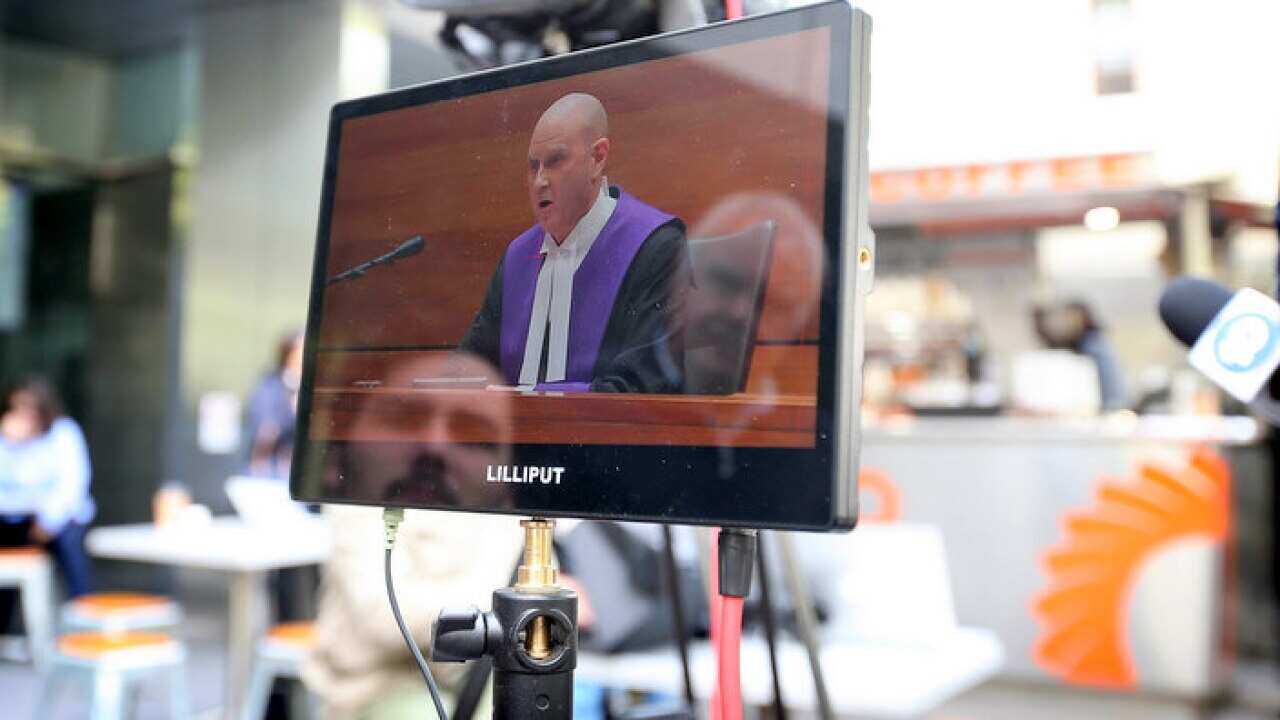 Chief Judge Peter Kidd is seen on a TV monitor outside Melbourne County Court on March 13, 2019 in Melbourne, Australia.