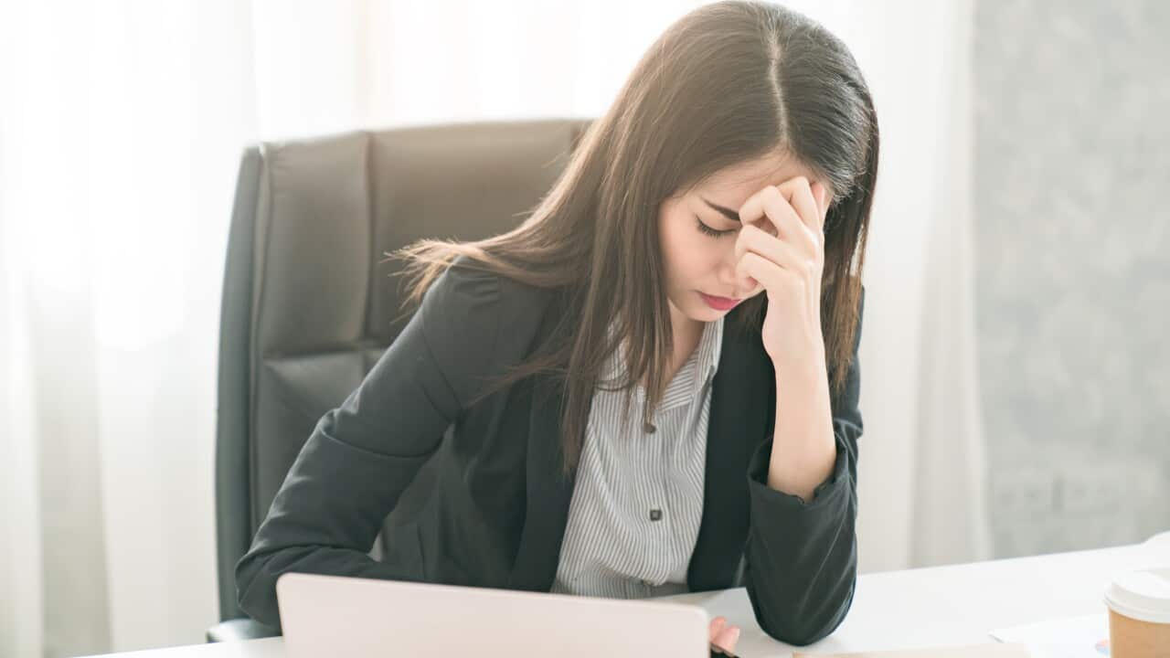 female worker looking tired