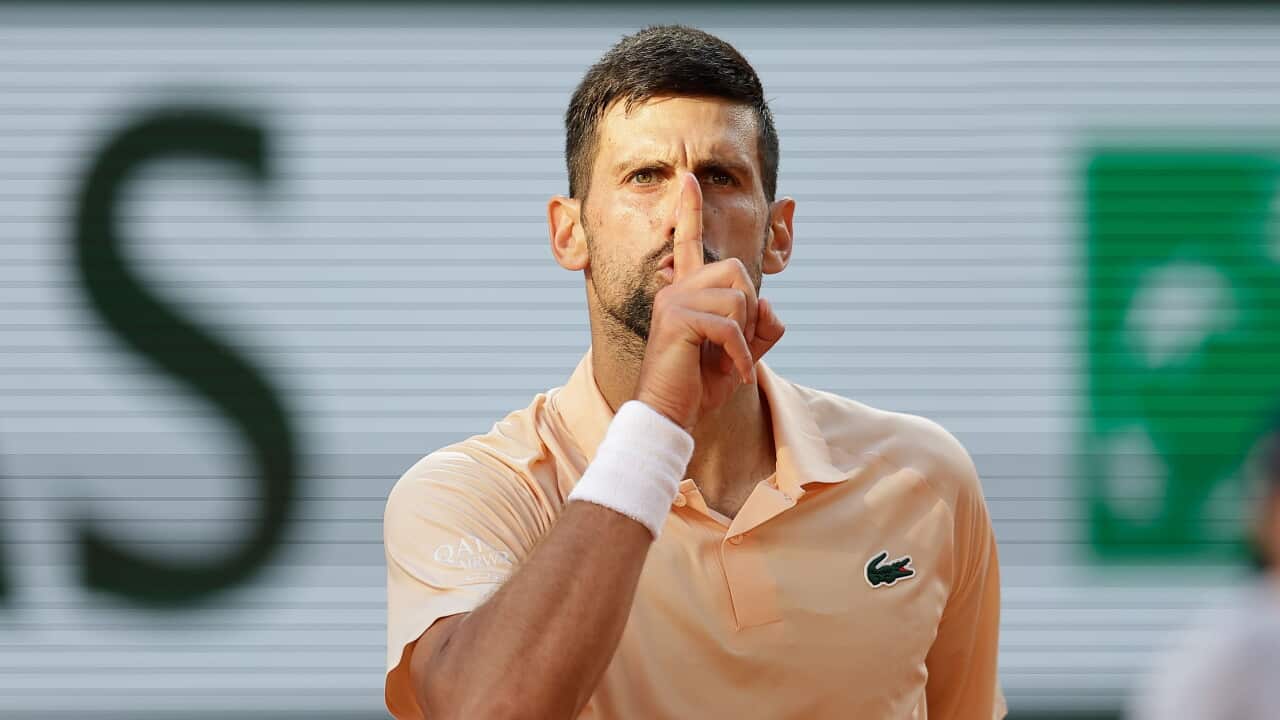 Novak Djokovic (Serbia) gesticulates to the crowd during his match against Valentin Royer at the 2026 Roland Garros in Paris