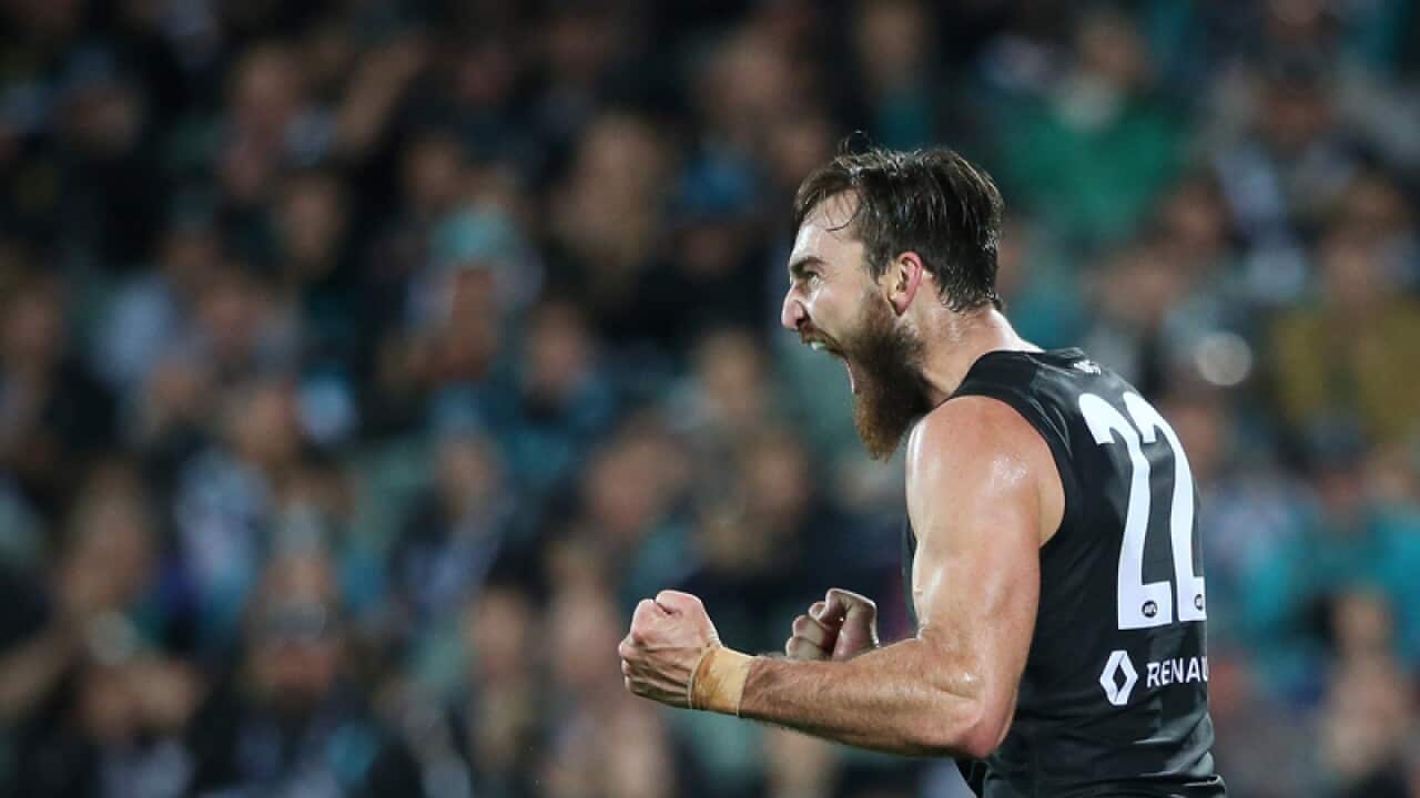 Charlie Dixon of the Power reacts after kicking a goal