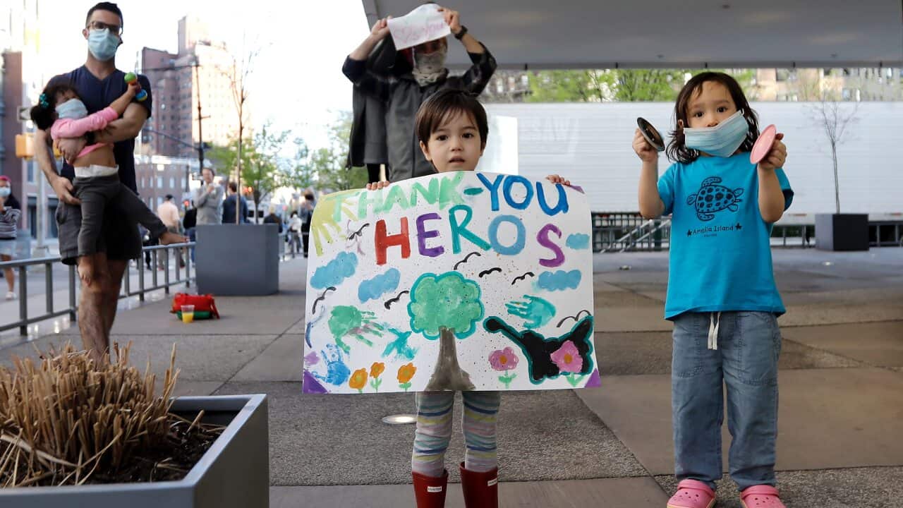 Children and adults attend a tribute to health workers at the Lenox Health Greenwich Village Hospital in New York.