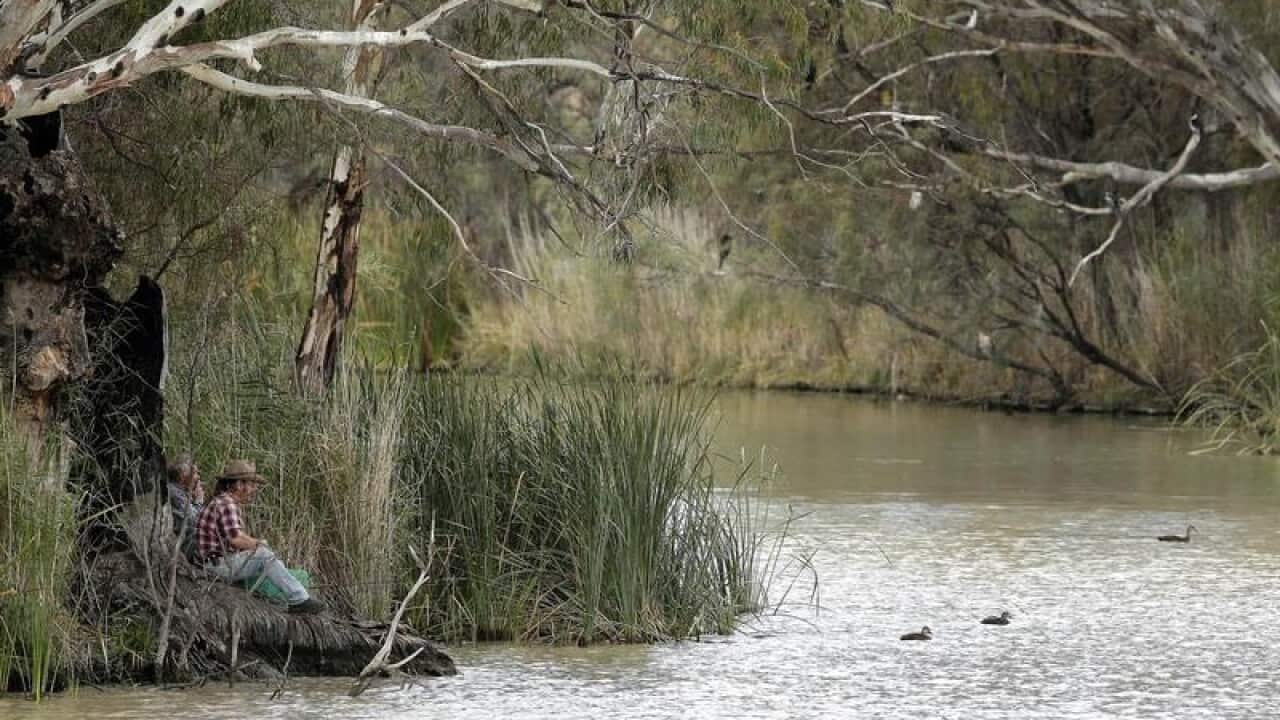 A file image of locals fishing on the Murray River