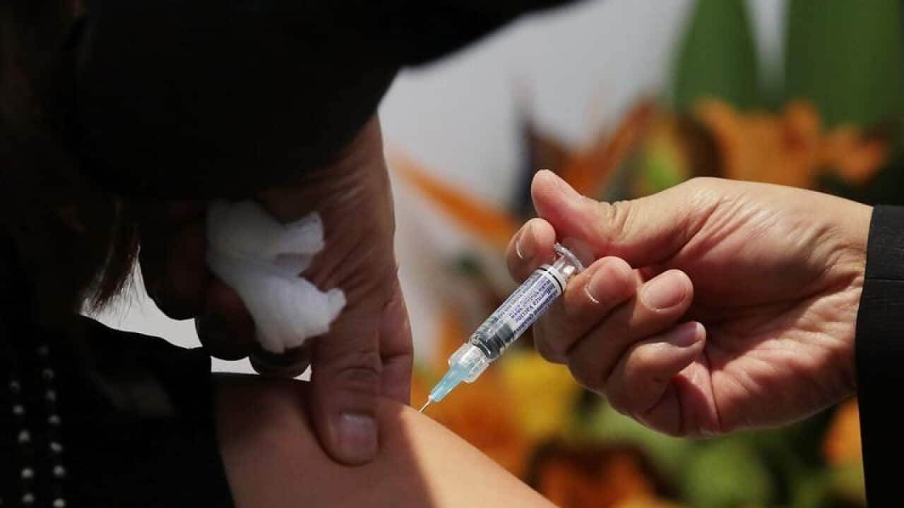 A member of the public receives a flu shot.