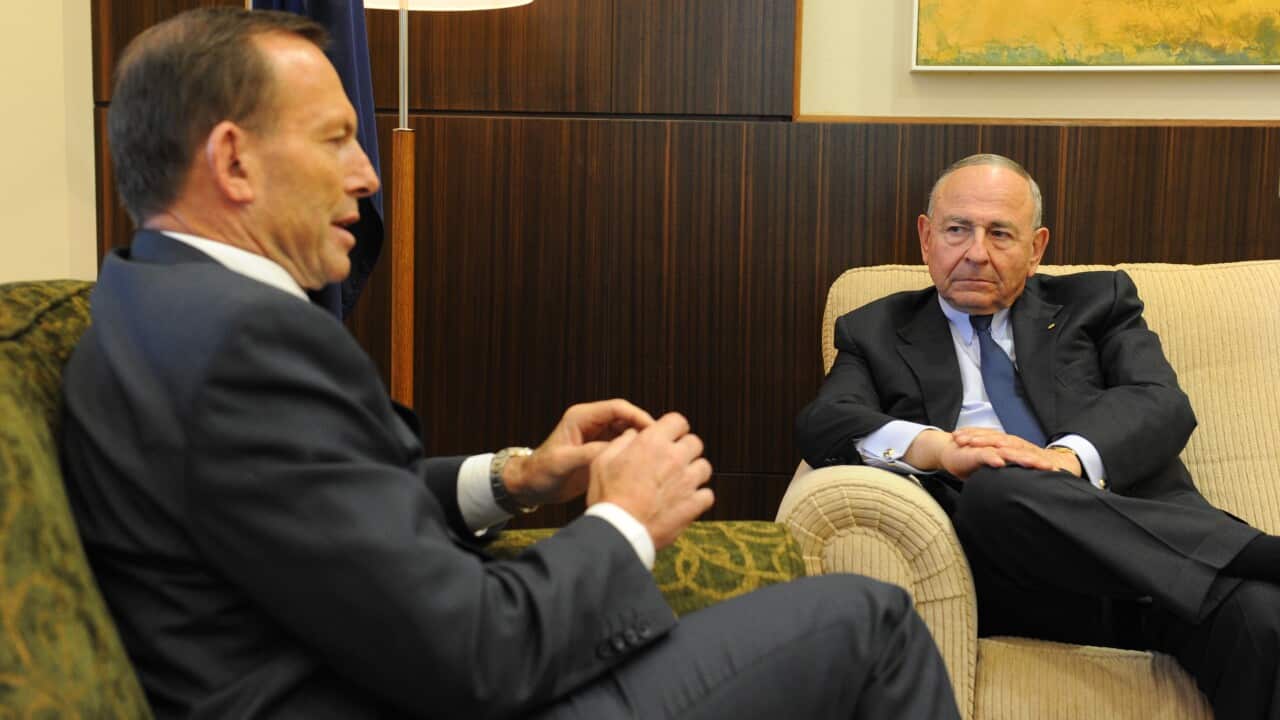 Prime Minister Tony Abbot (left) speaks with Maurice Newman